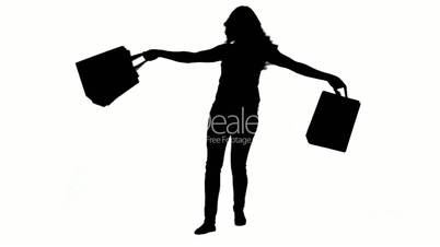 Silhouette einer Frau mit Einkaufstüten