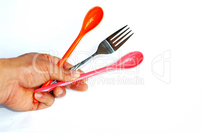 Spoons and fork in hand