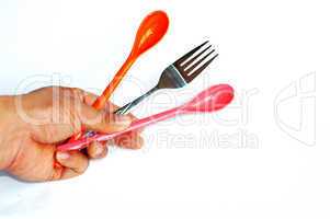 Spoons and fork in hand