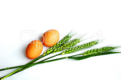 Green wheat ears and eggs