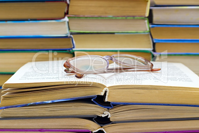 reading glasses lying on the  book