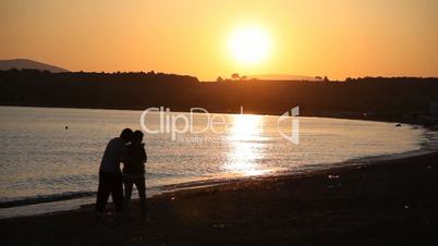 couple walking at sunset