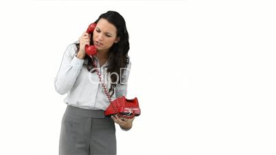Junge Frau mit rotem Telefon