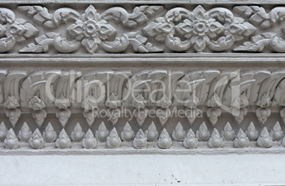 White stucco , thai style on the Wall