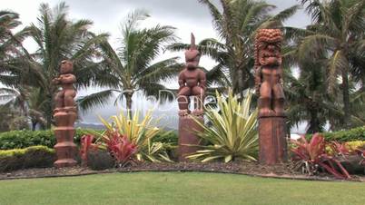 Hawaiian Tiki statues tropical park Hawaii