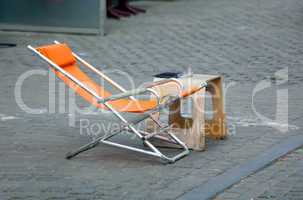 Orange chair with table in roadside cafe