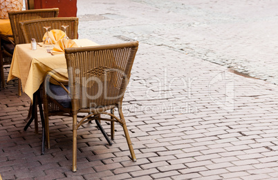 Empty cafe tables in Brussels cobbled square