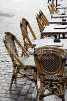 Empty cafe tables in Brussels cobbled square