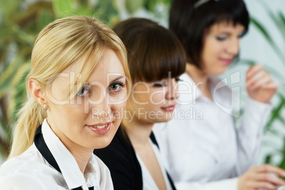 Young business ladies working in office