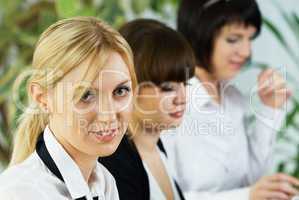 Young business ladies working in office