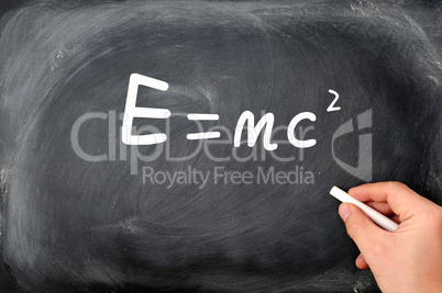 Relativity formula written on a  Blackboard background