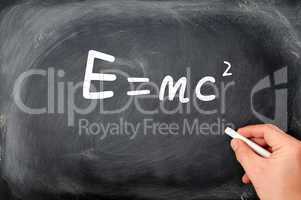 Relativity formula written on a  Blackboard background
