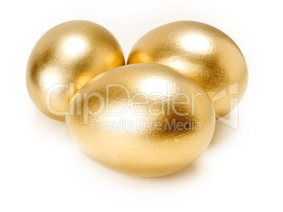 Golden eggs isolated on white background.