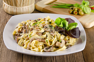 Tagliatelle with tail steak stripe and champignons