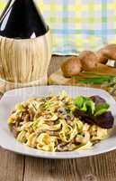 Tagliatelle with tail steak stripe and champignons