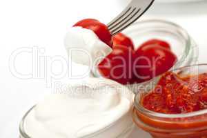 Sour Cream, Catchup and tomato on fork
