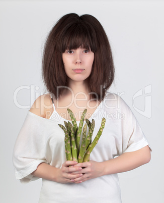 the young beautiful woman with the fresh vegetables