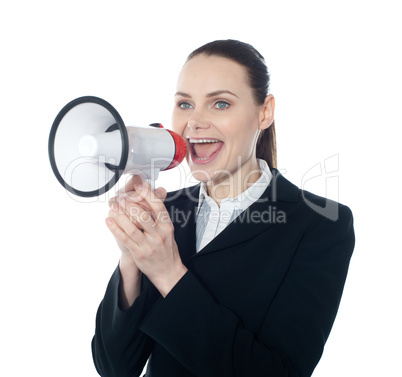 Pretty lady giving instructions with megaphone