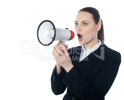 Business woman giving instructions with megaphone
