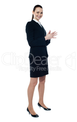 Full length of corporate smiling woman