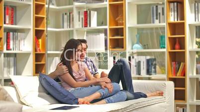 Happy loving couple take a photo in a living room