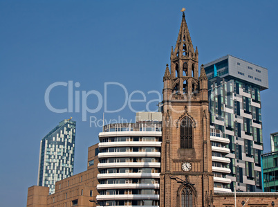 Old church amongst new high rise modern apartments