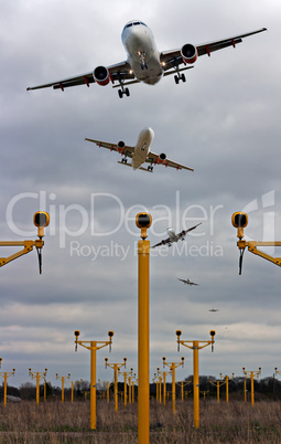 Composite of airplanes landing close together