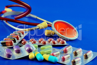 Pills and stethoscope