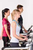Young people on treadmill running exercise