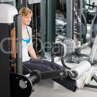 Young woman exercise legs at fitness center