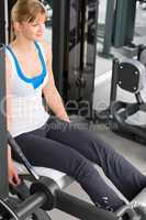 Young woman exercise legs at fitness center