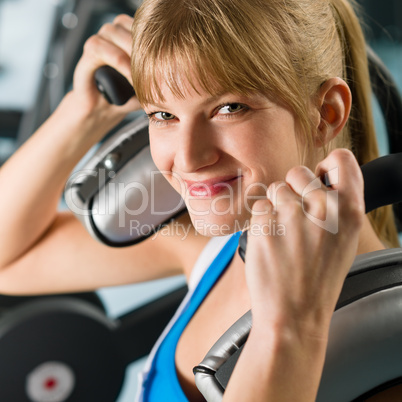 Young woman at gym exercise fitness