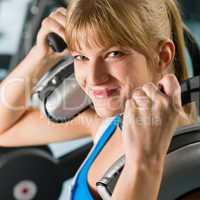 Young woman at gym exercise fitness