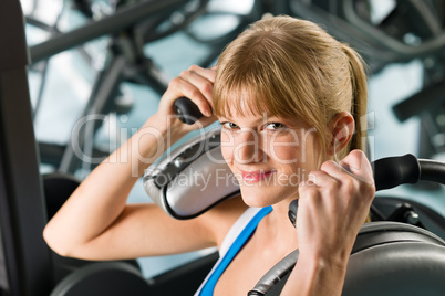 Young woman at gym exercise fitness