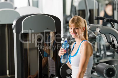 Young woman relax sit fitness machine