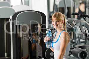 Young woman relax sit fitness machine