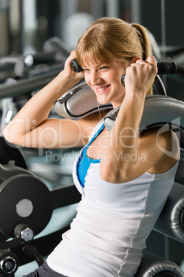 Young woman at fitness center exercise abdominal