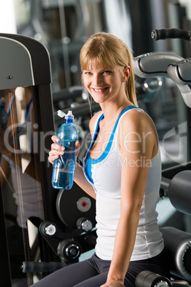 Young woman relax sit fitness machine