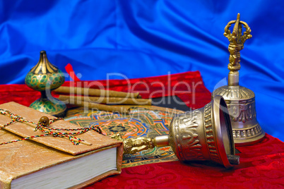 two Tibetan ritual bell and a book