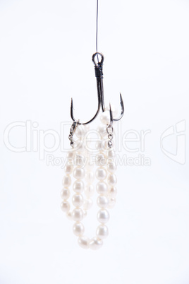 jewelry made of pearls hanging on fishing hook