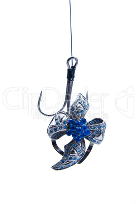jewelry hanging on fishing hook