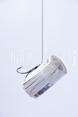 twisting banknotes hanging on a hook
