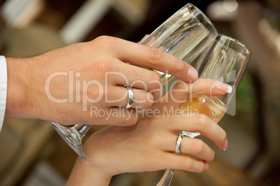 bride and groom holding glasses