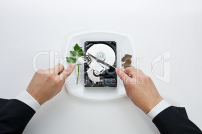 hard disk cut with a knife man