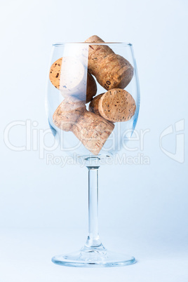 single glass wine with a corks of bottle