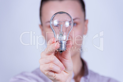 woman holding lamp