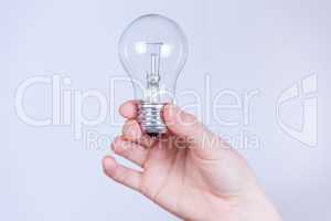 hand holds the electrical lamp