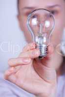 woman holding electrical lamp