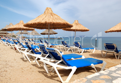 Sunbeds at the beach of luxury hotel, Crete, Greece