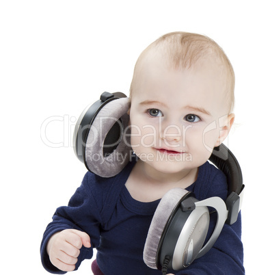 young child with ear-phones listening to music